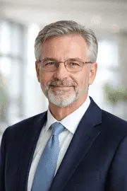 Professional headshot of senior law professor wearing suit and glasses