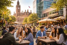 Manchester student area with university students socialising outdoors near historic architecture